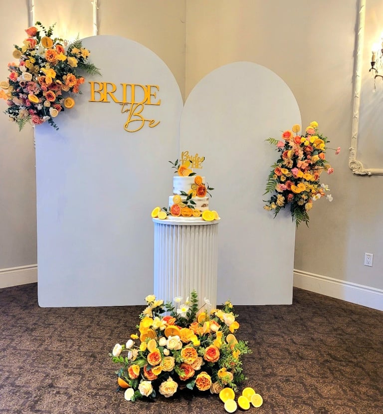 a bridal shower with a cake stand with a cake on top of it