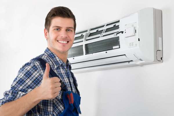 a man in overalls and overalls, holding a thumbs up