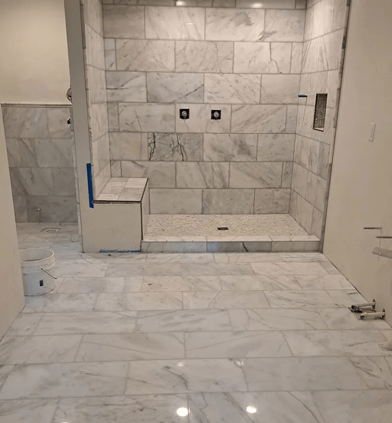 a bathroom with a shower and a toilet
