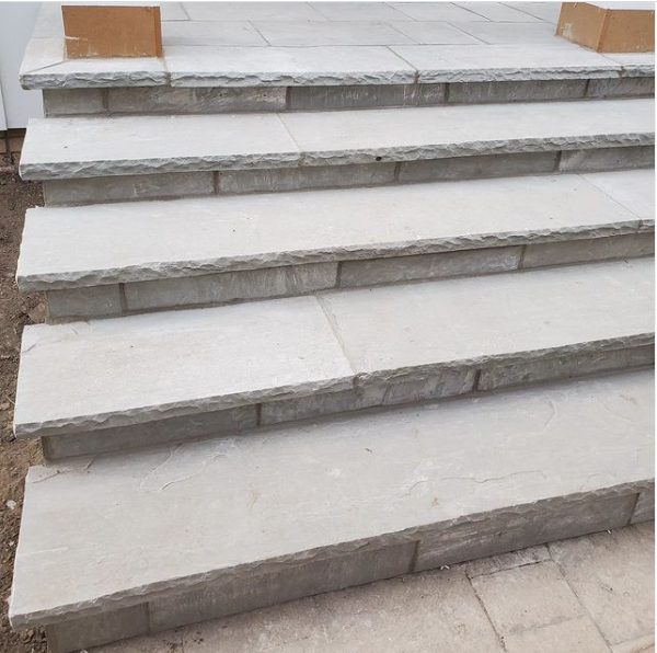 a set of stairs leading up to a patio