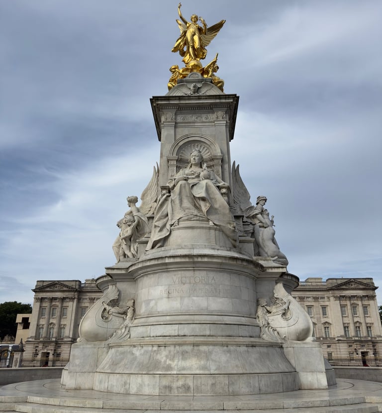 The Victoria Memorial monument in London with Buckingham Palace in the background.