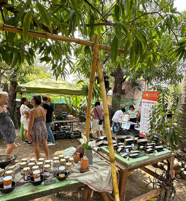 farmers market stand selling jams and pottery