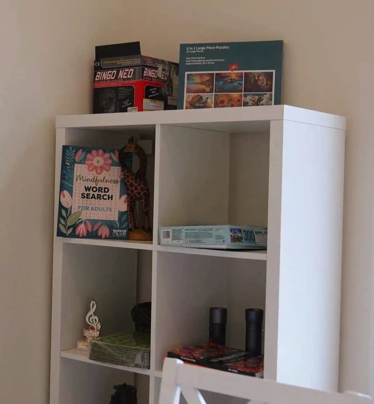 Adult family home activity area with games and entertainment, providing fun and engagement for residents.