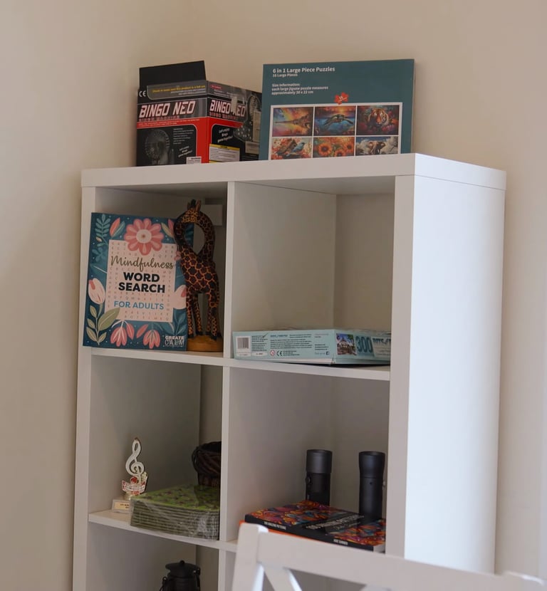 Adult family home activity area with games and entertainment, providing fun and engagement for residents.