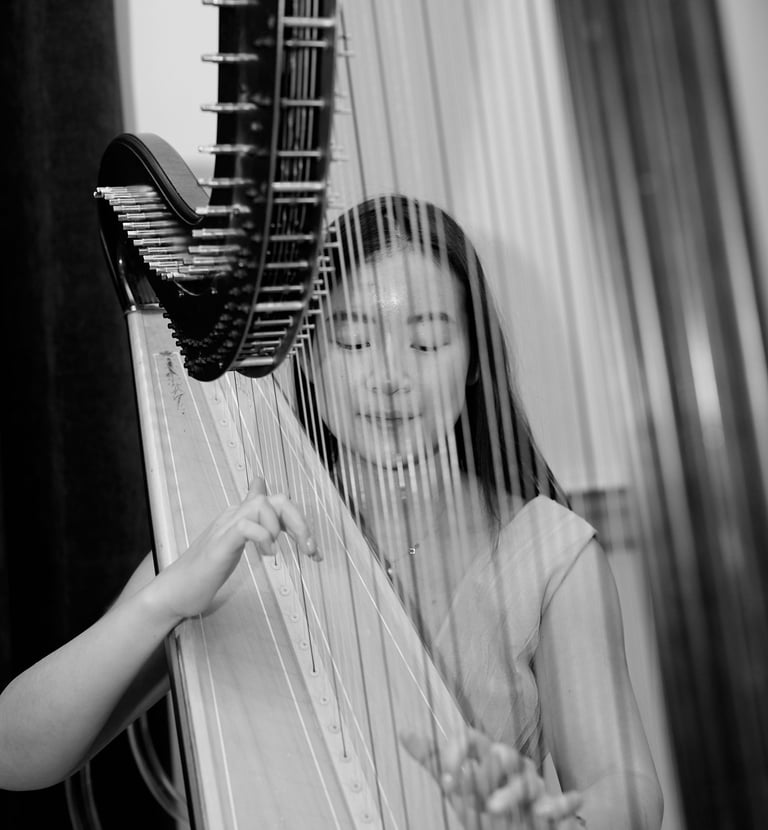 A harpist playing at a Luxelite Events