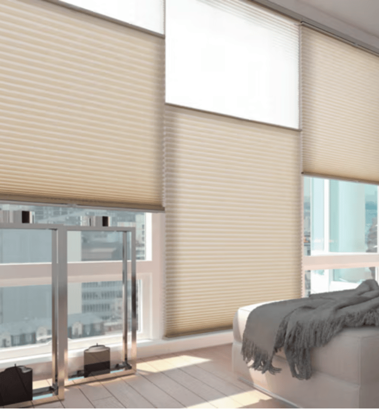 a bedroom with a bed and a large window
