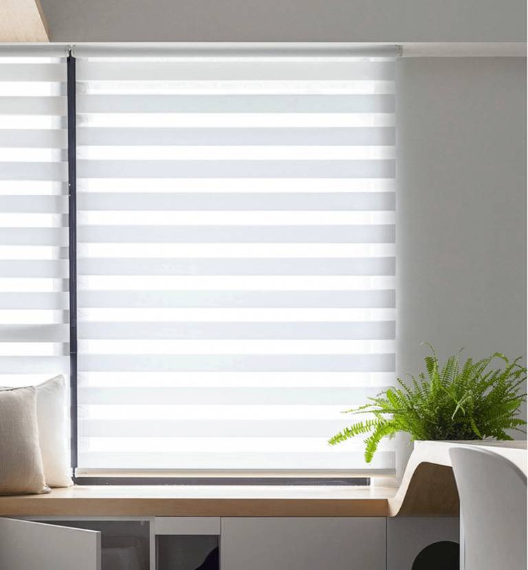 Movann motorized zebra shades in a cozy hotel room