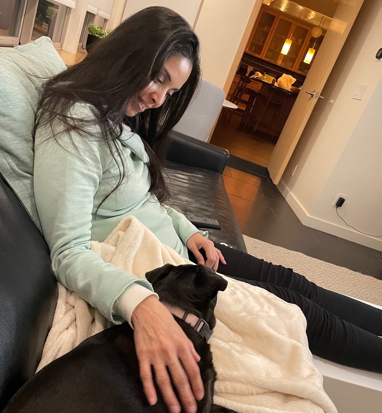 Sitting cozy on the couch with your pet