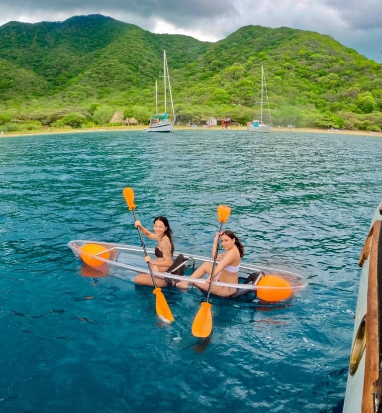 two people are kayaking in the water