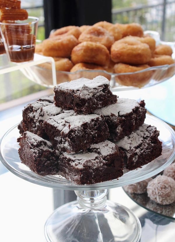 a cake with chocolate frosted sugar - covered chocolates