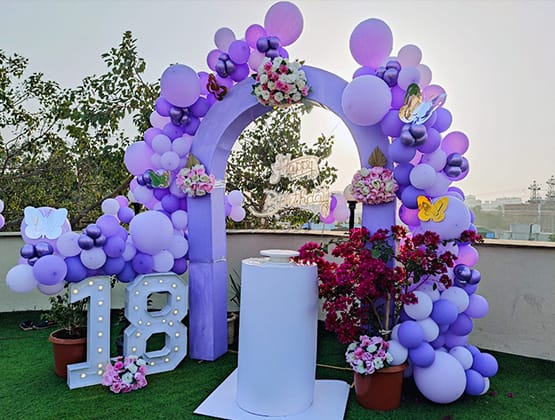 a purple arch shaped balloon - shaped arch shaped balloon
