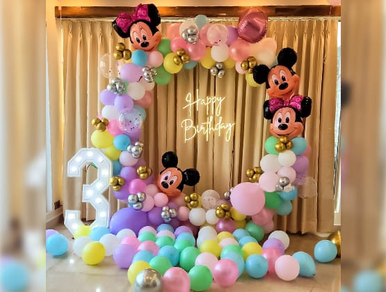 a birthday party with balloons and balloons