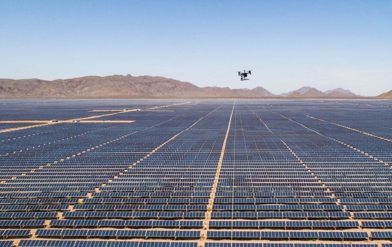 a droneflying over a large array of solar panels