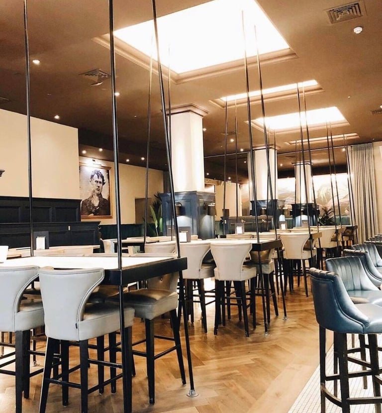 a restaurant with a long table and chairs