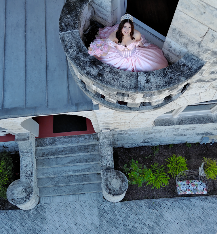 a woman in a pink dress sitting in a boat