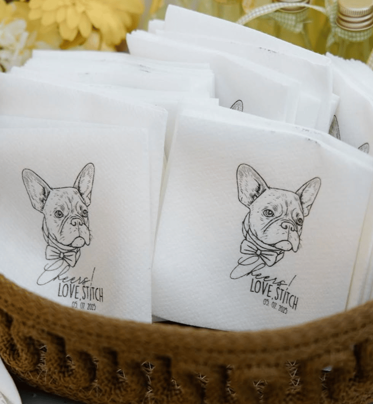 Custom wedding napkins featuring a French Bulldog illustration in a wicker basket.