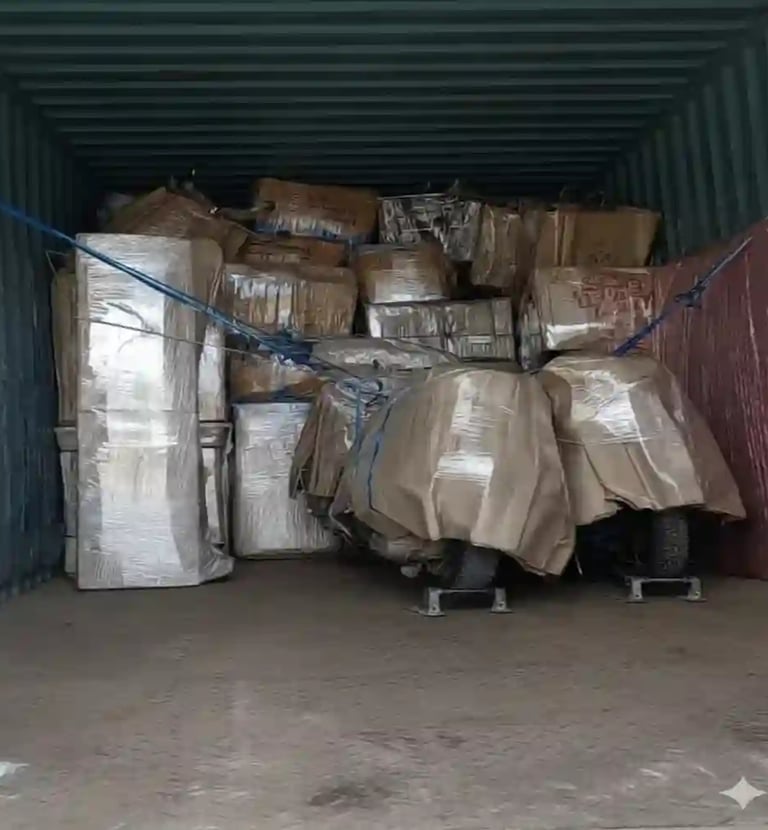 Packing and Loading household goods and bikes by Seemanchap Packers Movers