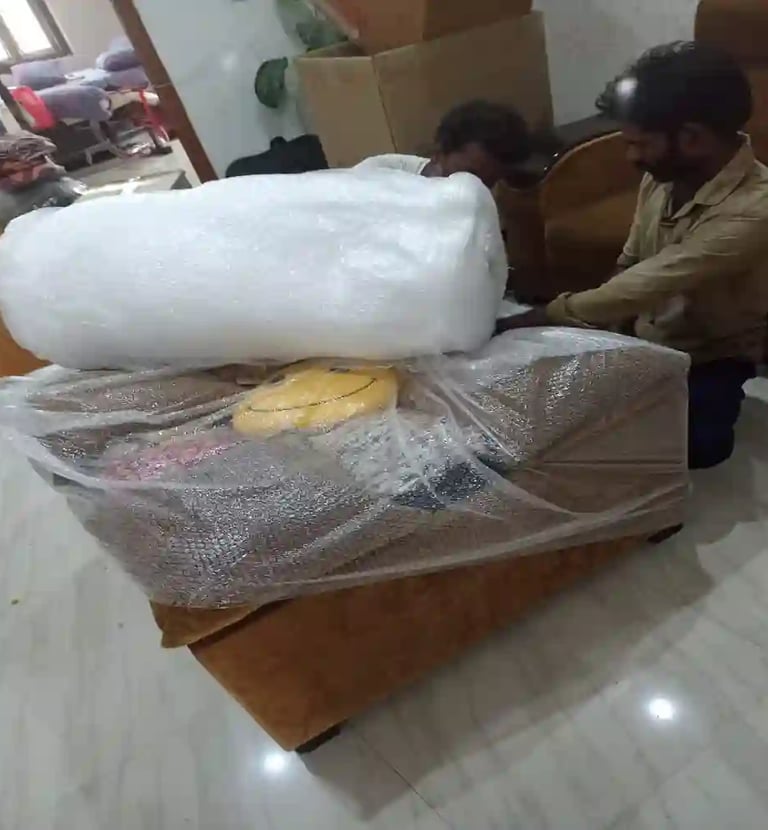 Professional sofa packing with bubble wrap by Seemanchal Packers & Movers for safe house shifting