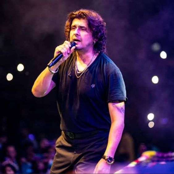 a man in a black shirt and a microphone