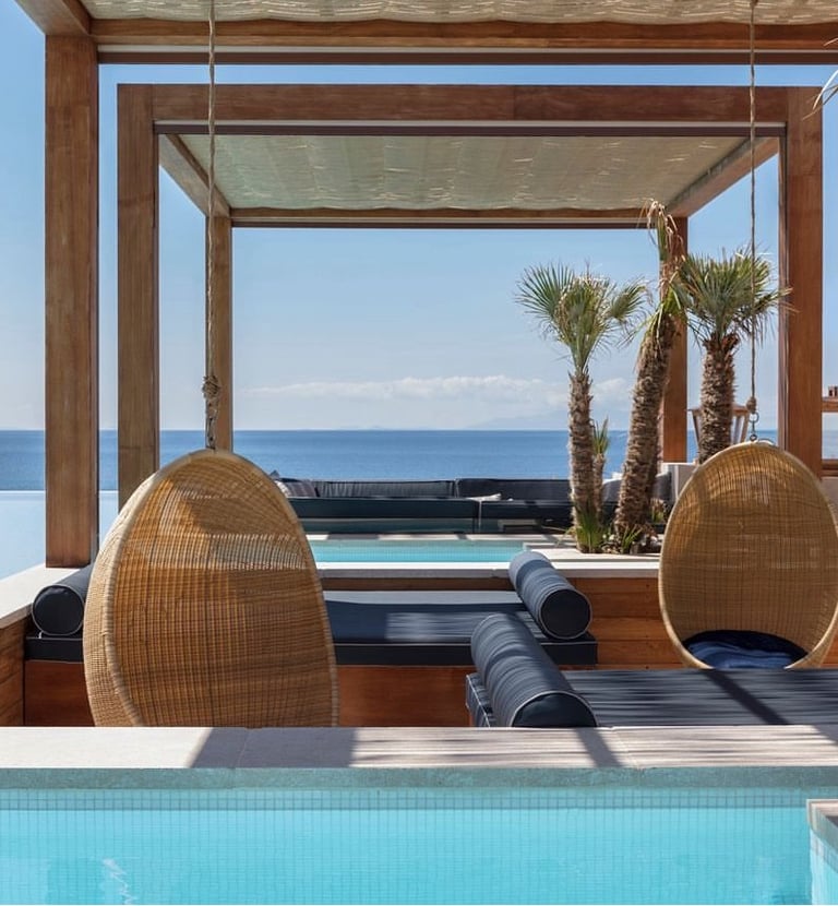 a lounge area with a lounge chair and a pool