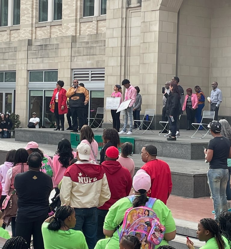 a group of people standing around a stage for GFW MLK Jr. Community Event