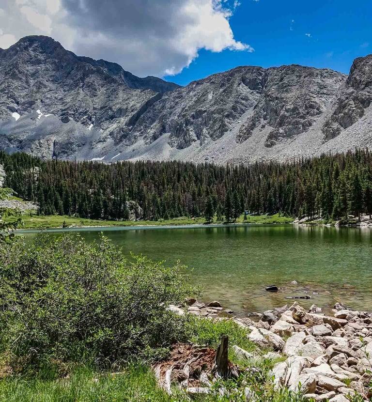 a lake with a mountain in the background