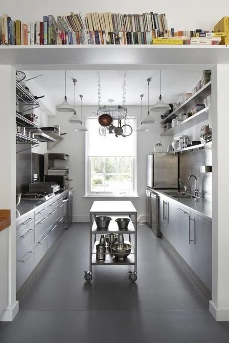 Modern home kitchen featuring a central mobile stainless steel island and custom benchtops from the About SSB team.