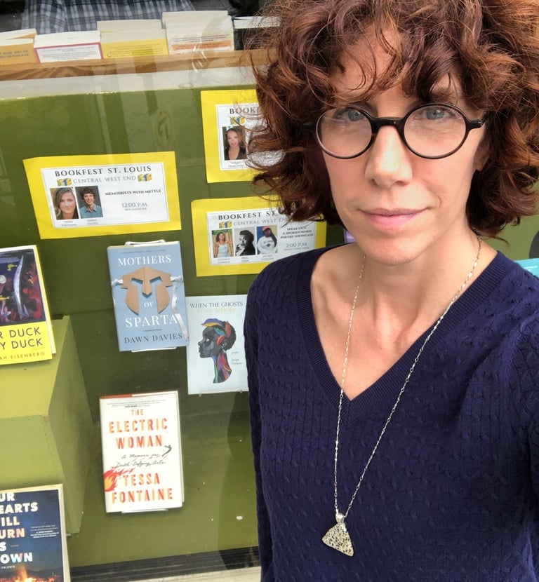 Author Dawn Davies selfie in front of a bookstore window