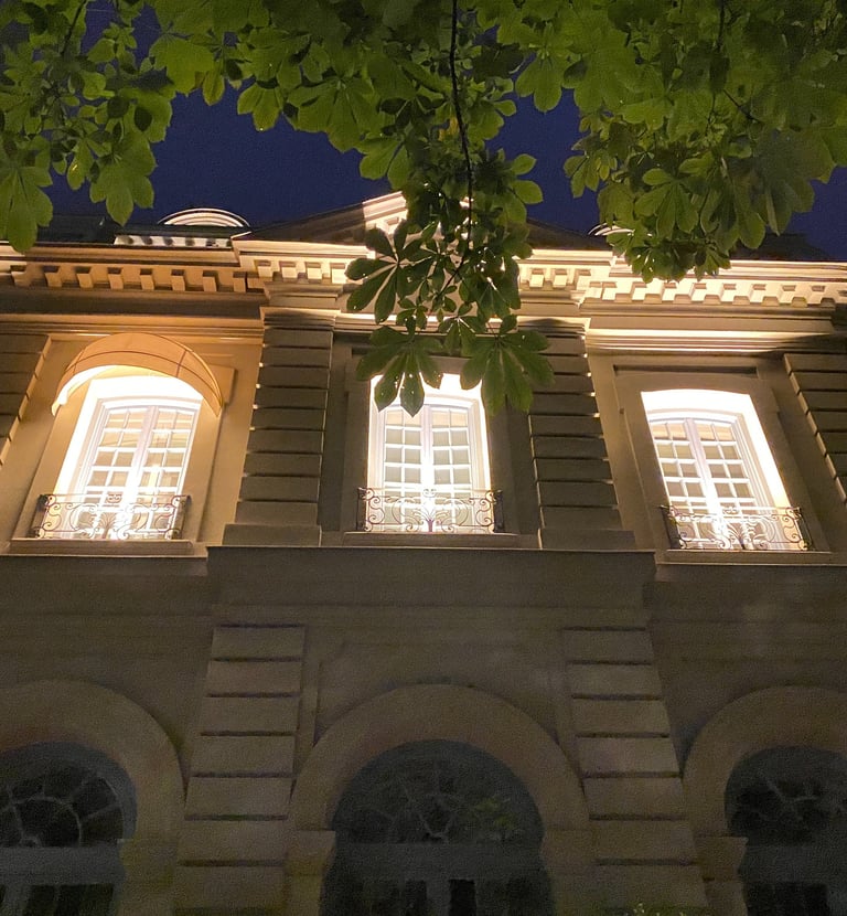 a building with a clock tower in the middle of the night