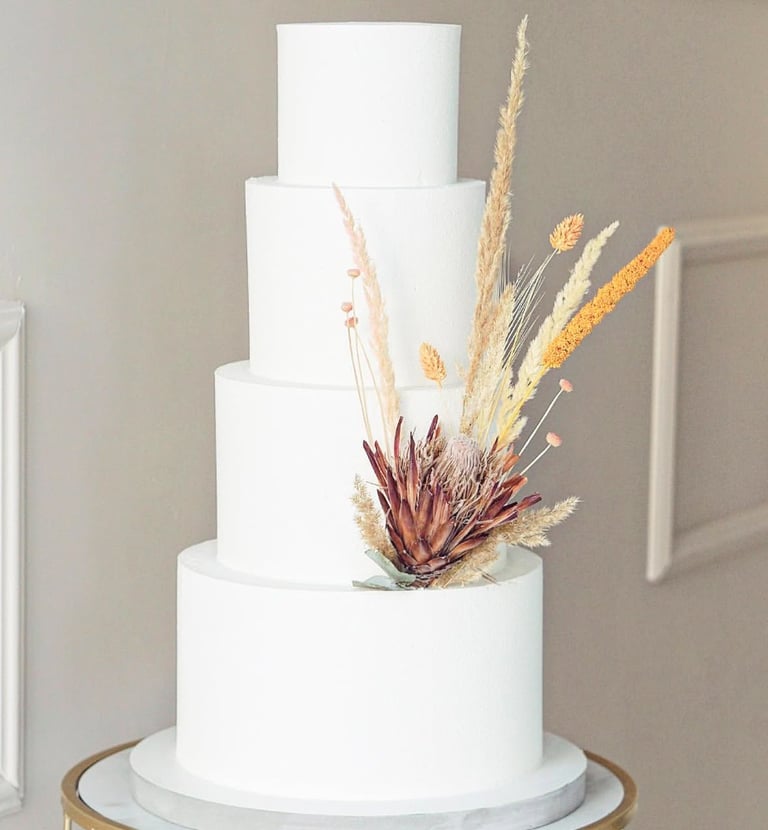 a white cake with a flower on top of it
