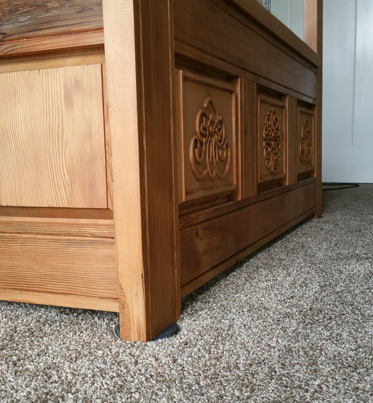 Handcrafted monks bench with Celtic knot work panels. Colorado Springs fine woodworking.
