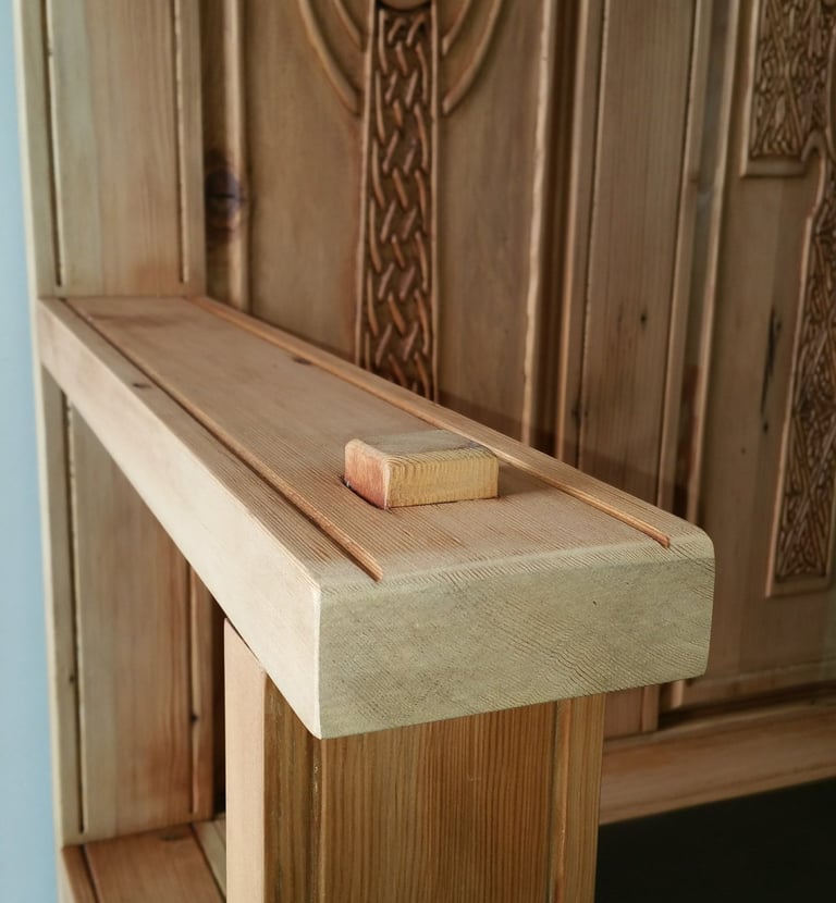 Handmade monks bench arm rest with mortise and tenon joint.  Back panels with carved Celtic Cross. Colorado Springs woodwork.