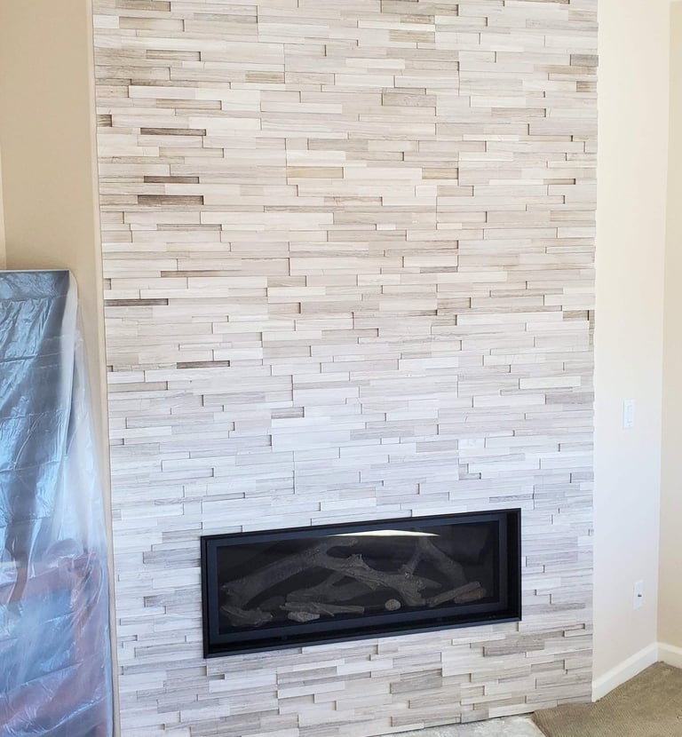 Stone work fireplace surround. recessed lighting. Custom fireplaces in Colorado Springs.