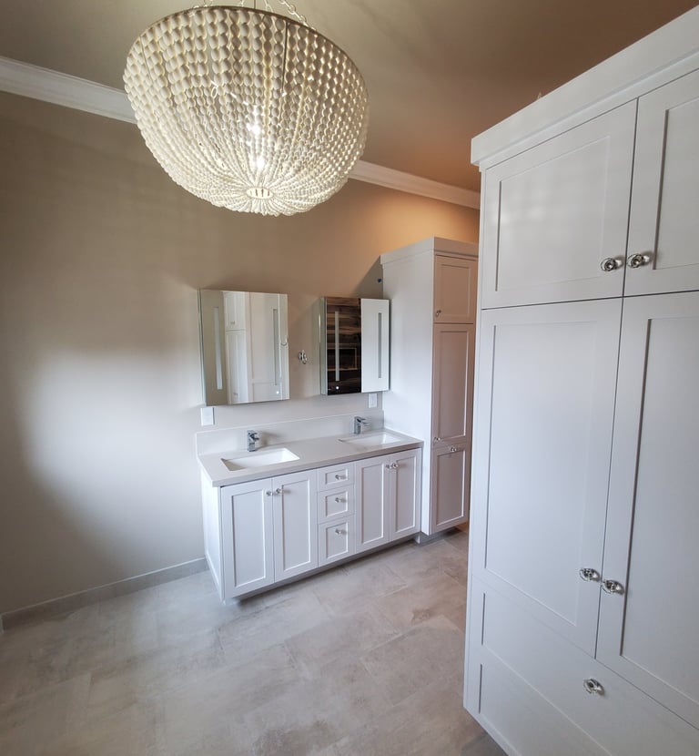 Bathroom remodel with ample storage.  to modern medicine cabinets above two sinks. Colorado Springs renovations.