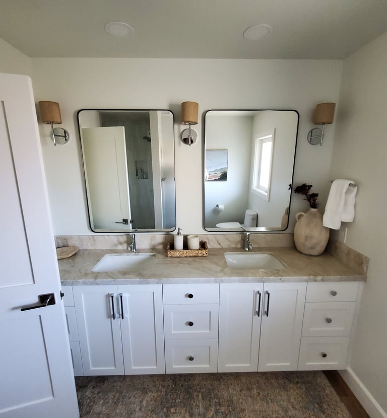 fully renovated bathroom with custom lighting, two sinks, granite counters and custom cabinetry. Colorado Springs.