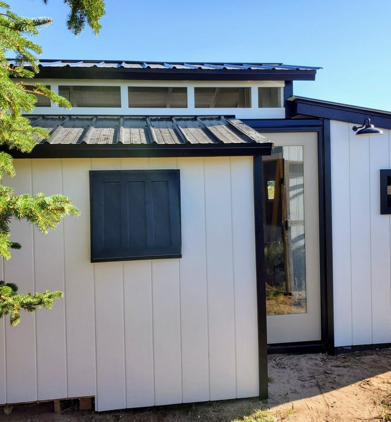 Exterior of custom rabbit barn in El Paso County near Colorado Springs.  removable window panels for increased air flow.