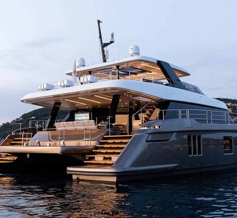 a boat in the water with a boat in the background