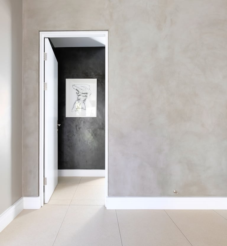 Modern home interior featuring CemCote Mist skimmed concrete surface, seamless and durable cement coating in Botswana