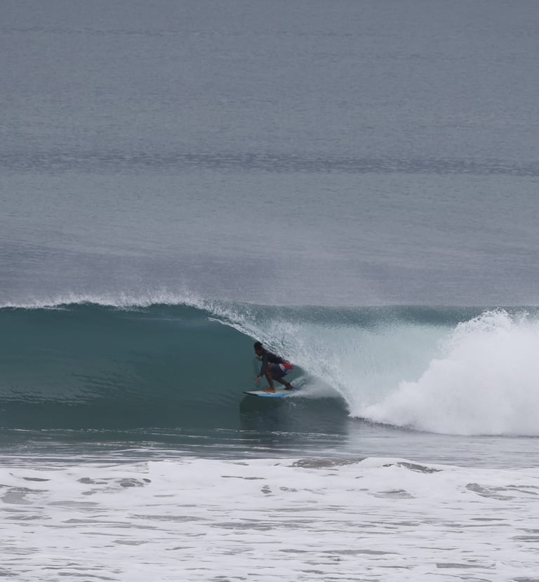 A surfer riding a perfect Ecuadorian tubular wave