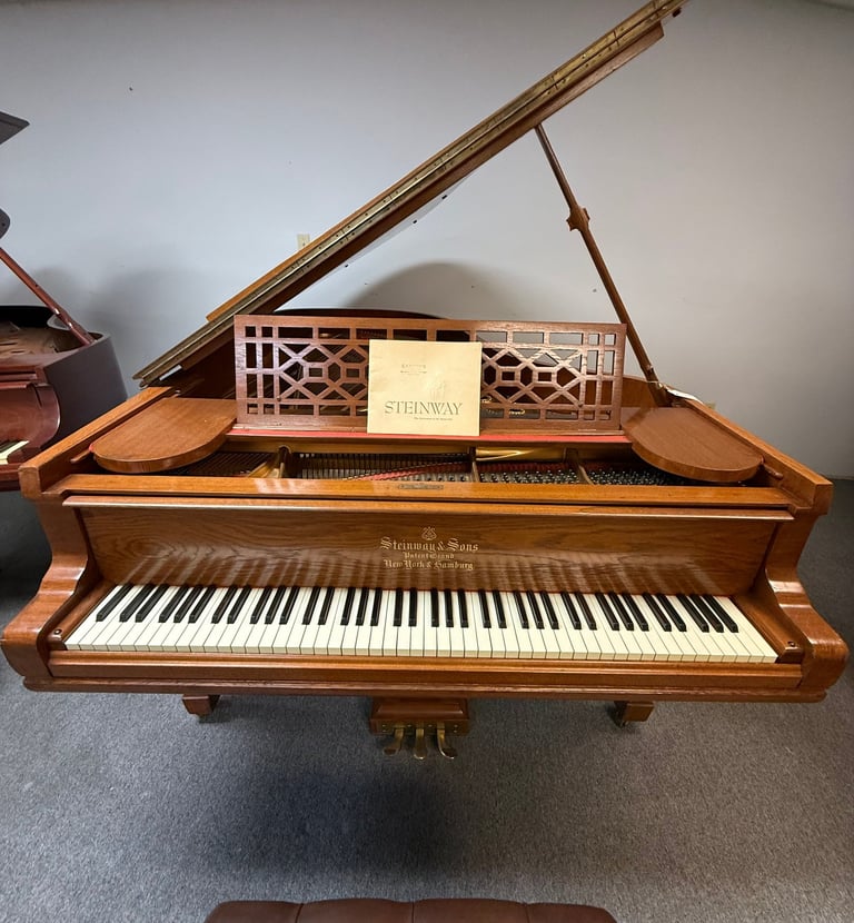 a piano and piano in a room with a piano