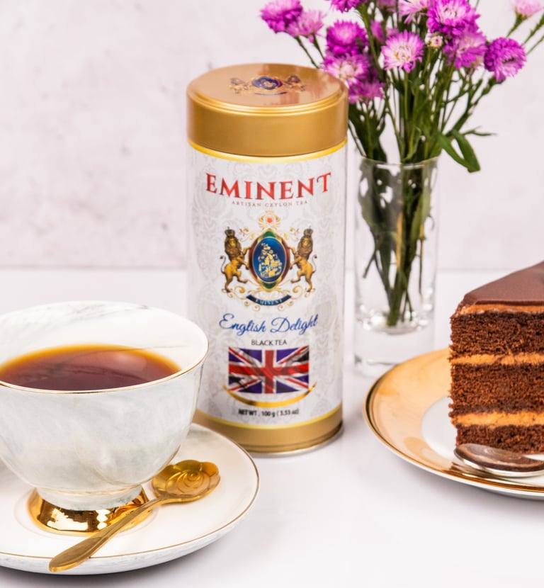 a piece of cake with a cup of coffee and a cup of tea