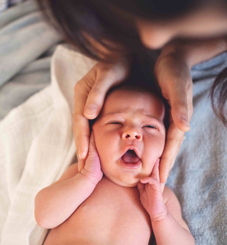 a baby is being held by a woman