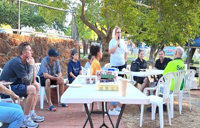 a group of people sitting at a table with drinks