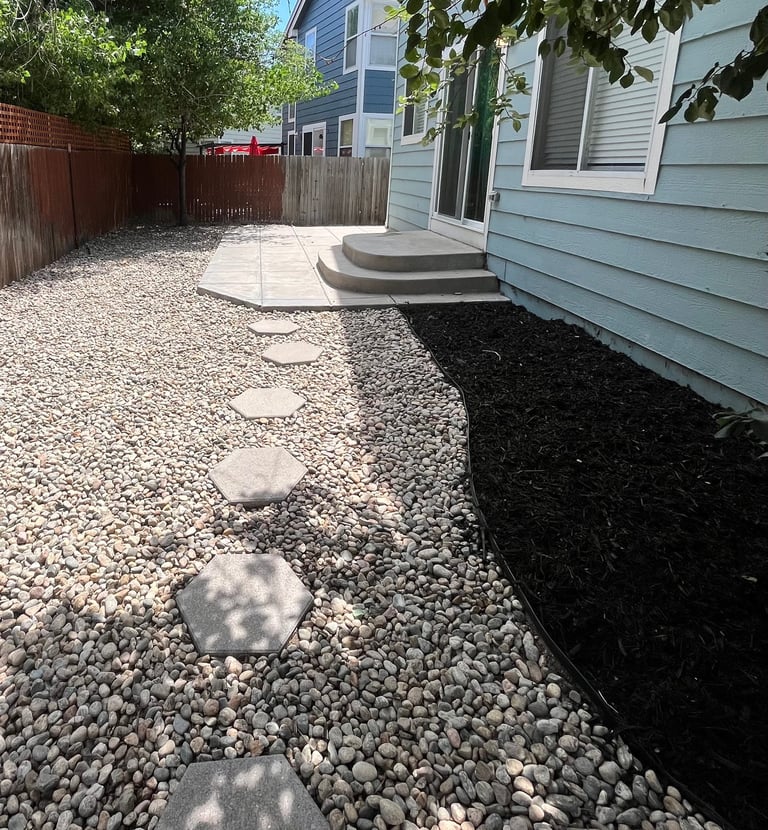 a major clean-up followed by the installation of Metro black mulch, a bold hexagon-pattern walkway