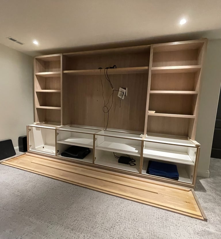 Custom-built entertainment center by Portugal Woodworks in Utah with ample storage and sleek design.
