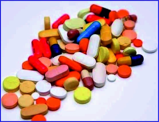 A diverse pile of colorful prescription pills, capsules, and medicinal tablets for healthcare treatment.