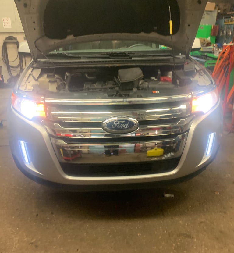 Suv after headlights being replaced and tested