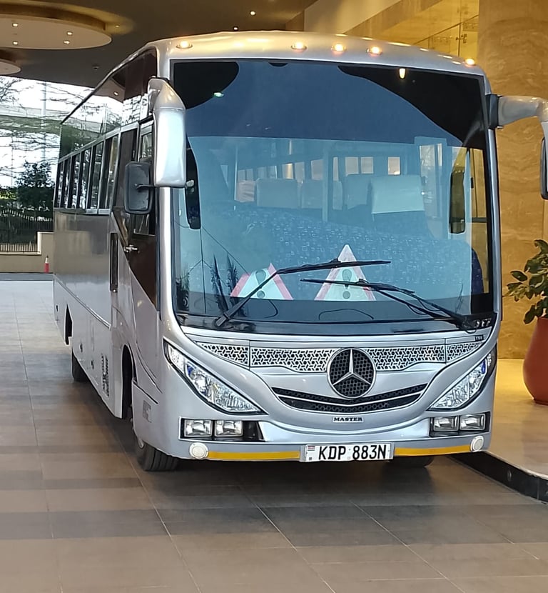 Mercedes-Benz luxury tour bus for passenger shuttle service for hotel guests in Nairobi.