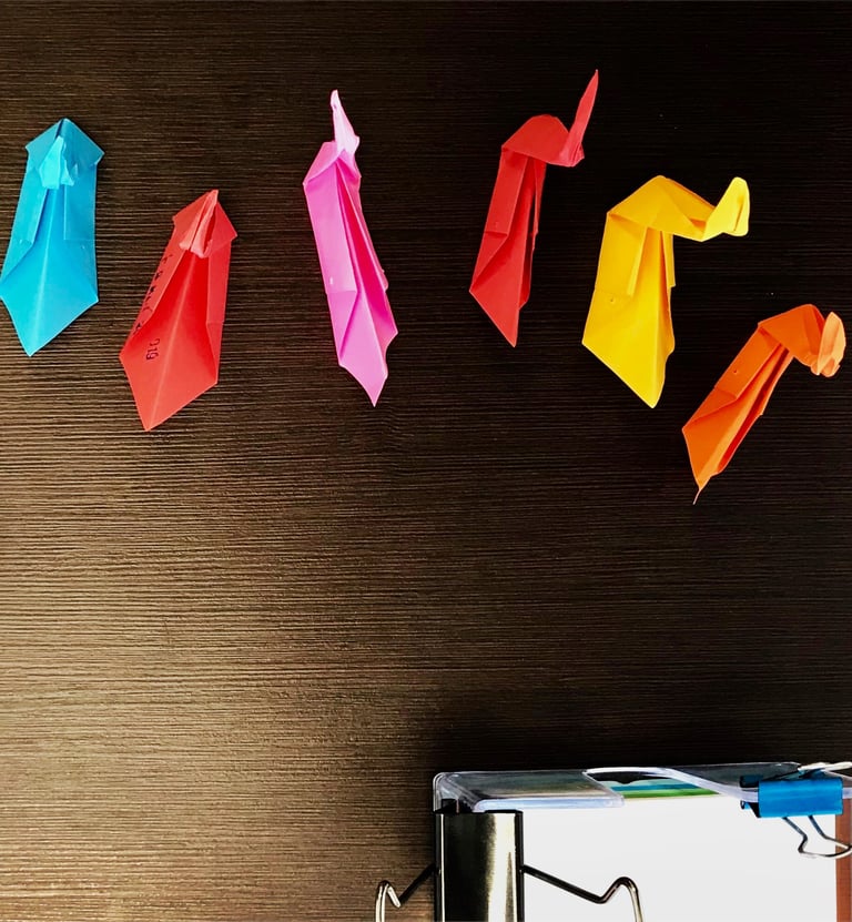 Origami birds of different colors.