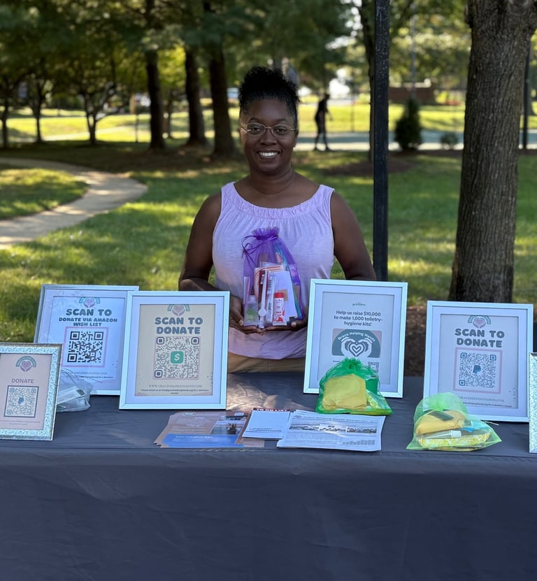 a woman standing behind a table with a table with a table cloth